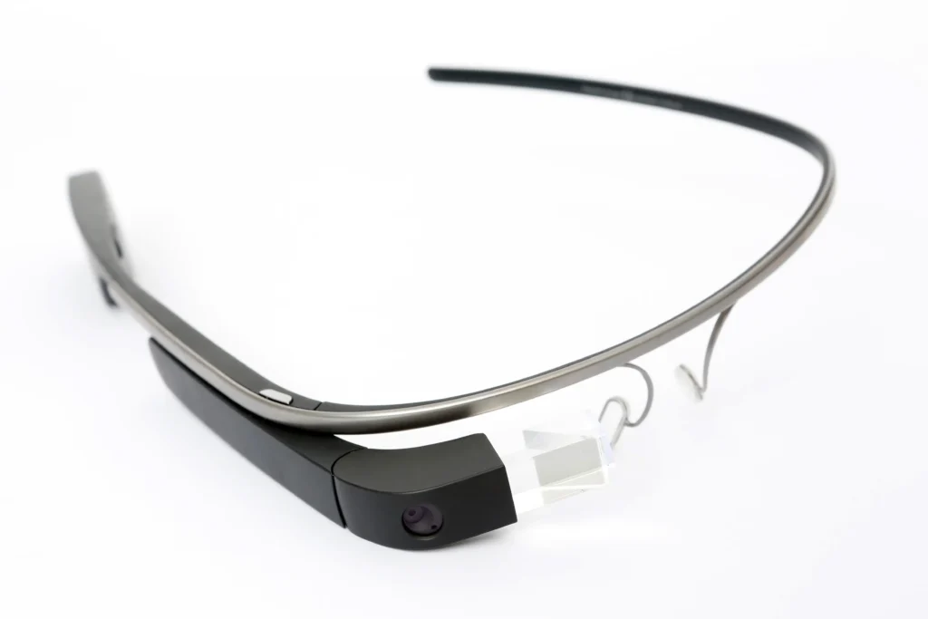 Detailed shot of the original Google Glass wearable computer and head-mounted display, showing its unique prism and frame.